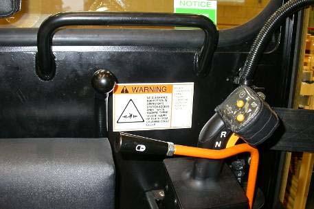 Safety Features Steering and Implement Lockouts If the operator fails to apply the parking brake and steering lock prior to exiting the the cab, the interlock system will