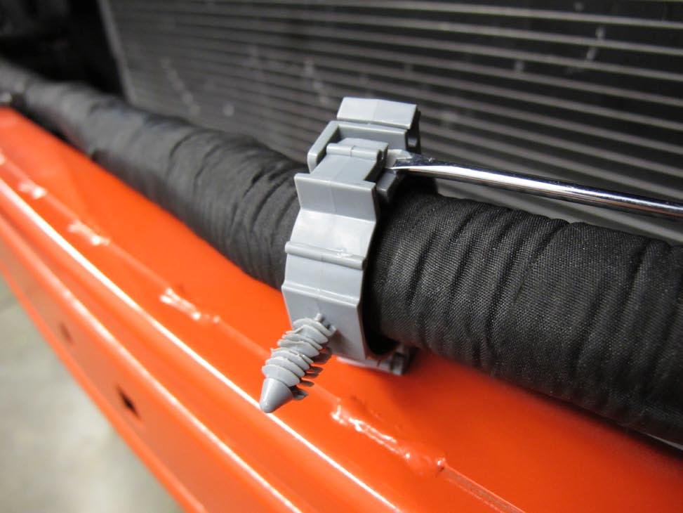 Free the harness from the bumper support. (See Fig. 2-e) F. Release the gray clips from the wire harness & set aside.