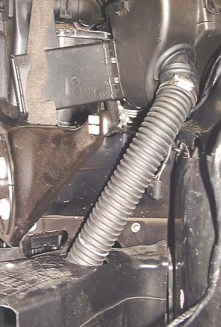 Feed the flex air hose down into the hole you cut out of the brake duct. See figure 13.