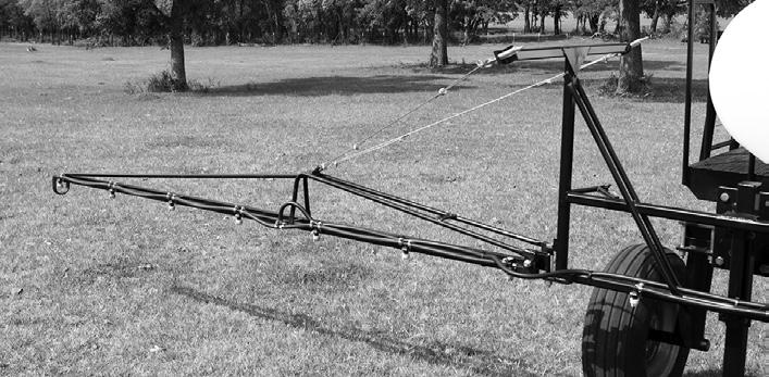 The length of the boom will determine if it is equipped with a secondary section. With the sprayer positioned in an open area, remove the lock pin while holding the boom.