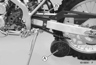 62 MAINTENANCE AND ADJUSTMENT Tighten the chain either by using the chain adjusters or by hanging a 10 kg (22 lb) weight on the chain.