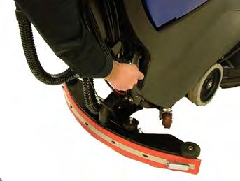 Place your foot on the pedal and depress the lever while shifting it to the right. Once clear of the lower notch, lifting your foot will lower the scrub deck into the operating position.