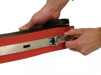 2 Remove the squeegee assembly from the machine by loosening the easy-grip knobs and detaching the recovery hose at the back of the machine.