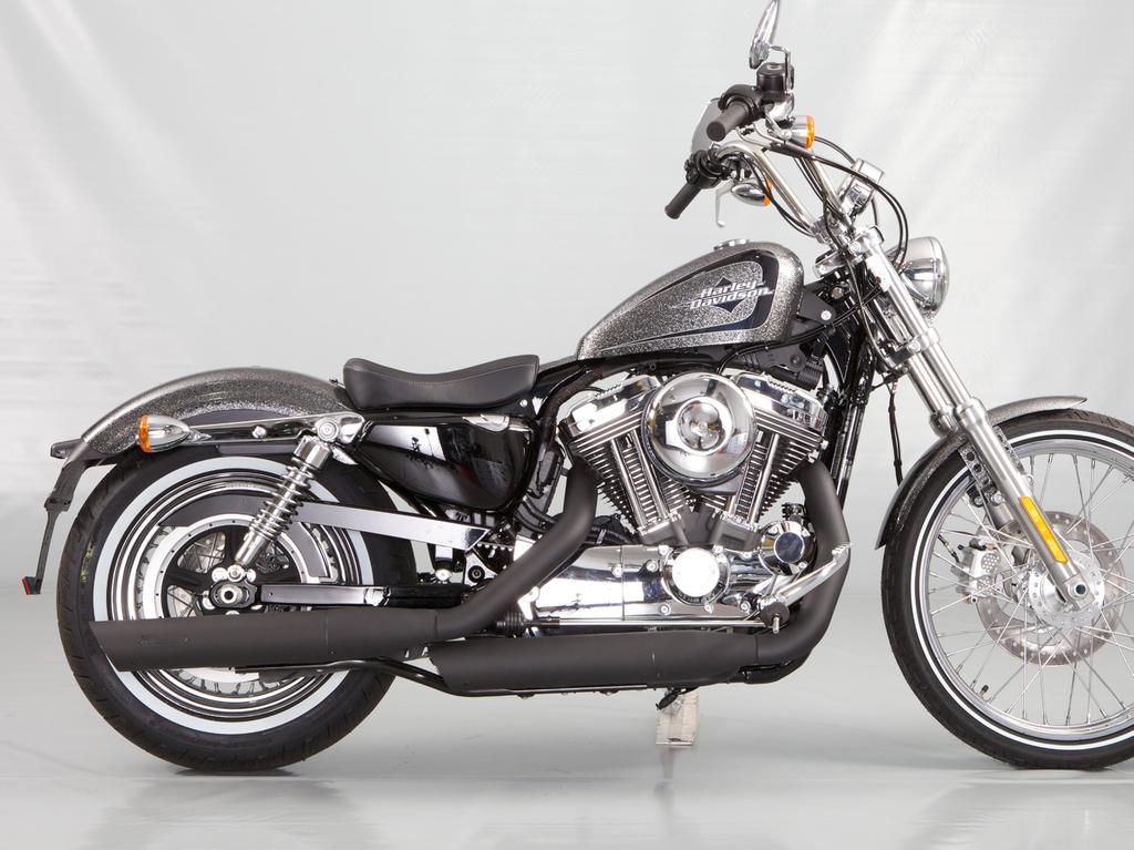 Install the mufflers and heat shields onto the motorcycle;