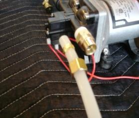8 b. The female compression adapter comes apart, and the parts are attached to the PEX tubing as