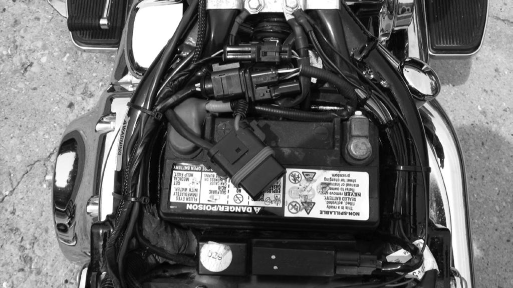 Using an easy turn wire connector attach the power wire from the EMS to the headlight circuit.