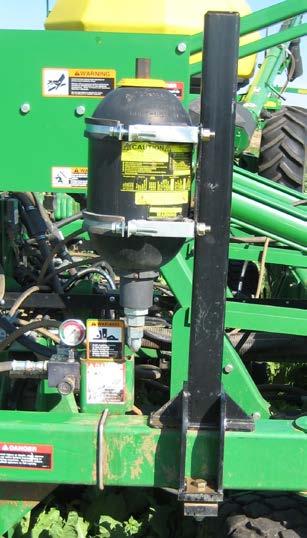 Photo K. UniForce valve block on box drill. Yours should have a 90-degree fitting on outboard side to reduce loop of hose needed.