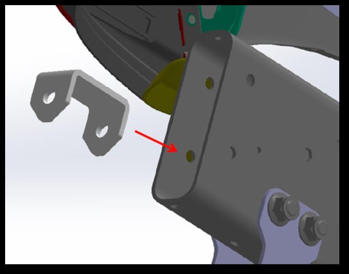 13. With the OEM spacer pulled up, insert the provided anti crush spacer into the frame rail and align it with the holes previously drilled. The spacer should form a box around the two hole pattern.