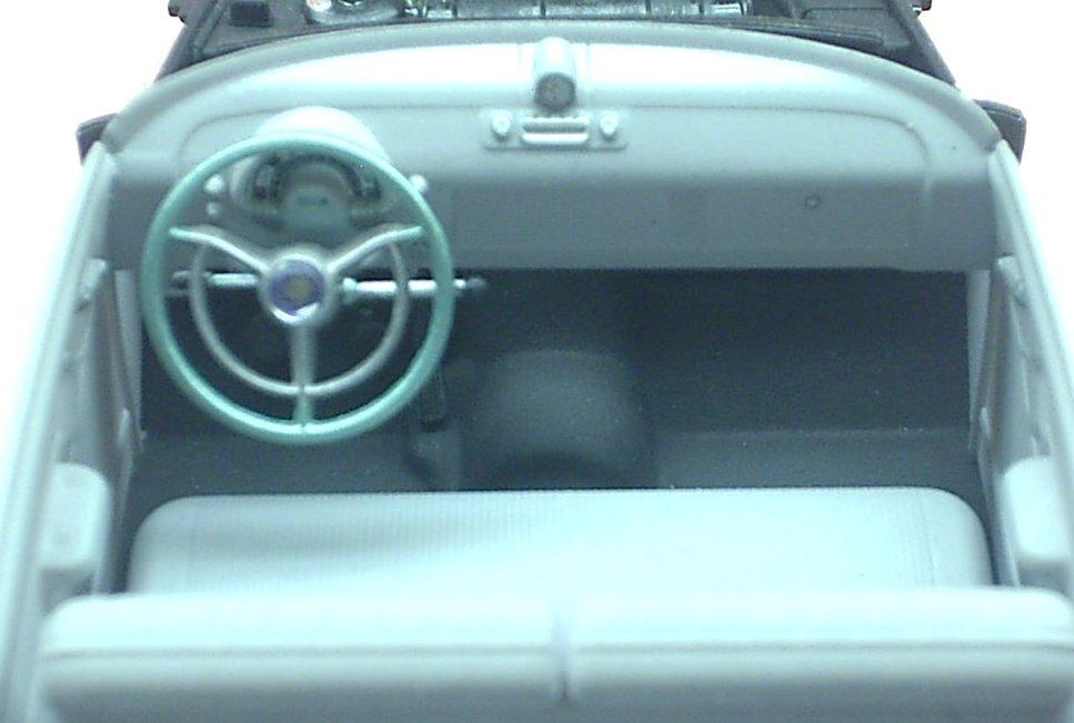 There is a decal for the center of the steering wheel, as well as a clear "dome" for the center of the wheel. The horn ring was also painted silver. (Fig.