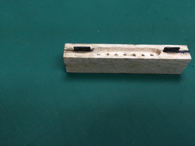 hobbyist threaded rod.) with an aluminum locknut. The locator part is 1/2 x ¾ balsa with a 0.