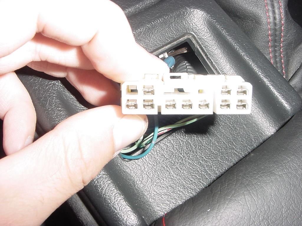 Step 8: Once you put the wire in simply plug the harness into the switch and put it into the center console. And remember to test it to see if it works.