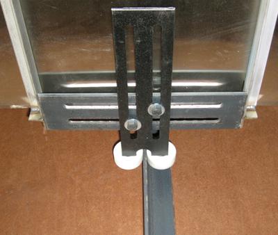 The opposite guide rail is a 2 x 1 x 1/8 aluminum angle with mounting hardware.