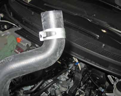 supplied radiator hose using the stock hose clamps. f.