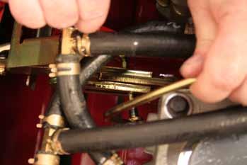 8. Serial range 290000210 and up: Slide the right hand roller onto the rear end of the right hand shifter link rod.