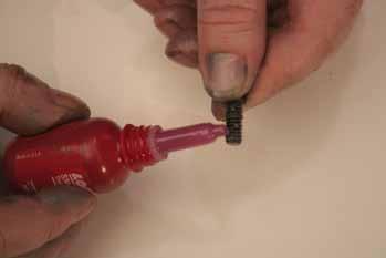 Using a spring removal tool (Toro Part No.