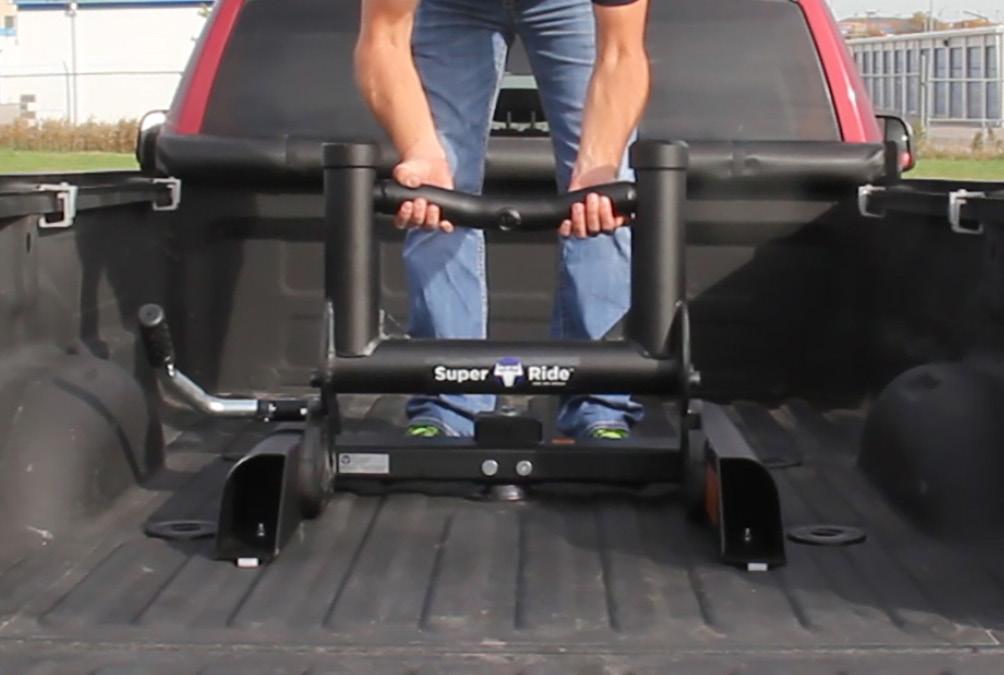 Upper Assembly Initial 1. Release locking handle by pulling the handle towards the rear of the truck bed.