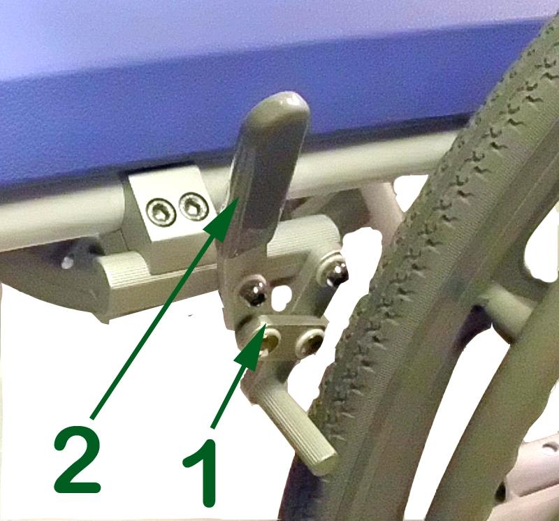 Holding the wheel by the spokes, once again push the quick release button (1) with your thumb and pass the portion of the axle protruding through the back of the wheel through the axle housing (2)