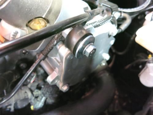 b. Install the provided coupler and hose clamps onto the turbo with the small end