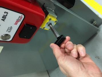STEP 2 While firmly holding the actuator in your right hand, disengage the magnets by pushing the