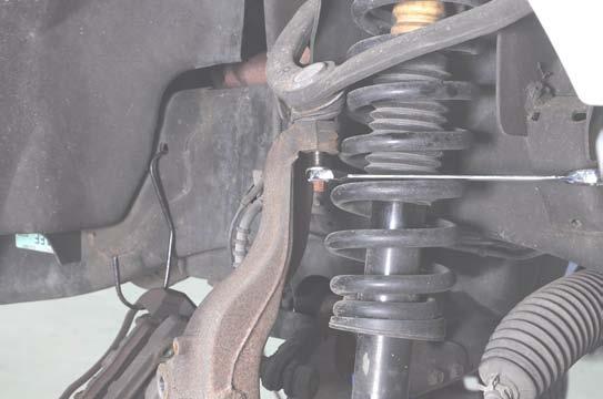 0. Using a 22mm wrench, loosen the upper ball joint nut.