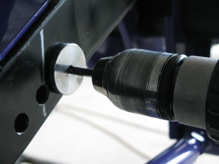 IMPORTANT: Make sure the drill fixture is flush to the framerail and parallel with the bottom edge of the framerail to insure the frame is drilled properly to allow the anti-roll bar mounting bracket