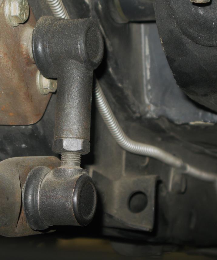 NOTE: When tightening the nuts on the antiroll bar end links, use a 14mm wrench on the link and an 18mm wrench on the lower link nut.