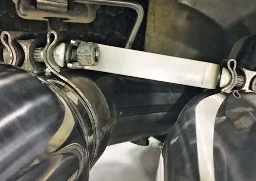 Place an exhaust tip (1117-5230TIP) in each clamp. Position so that the ROUSH logo is facing up. 20.