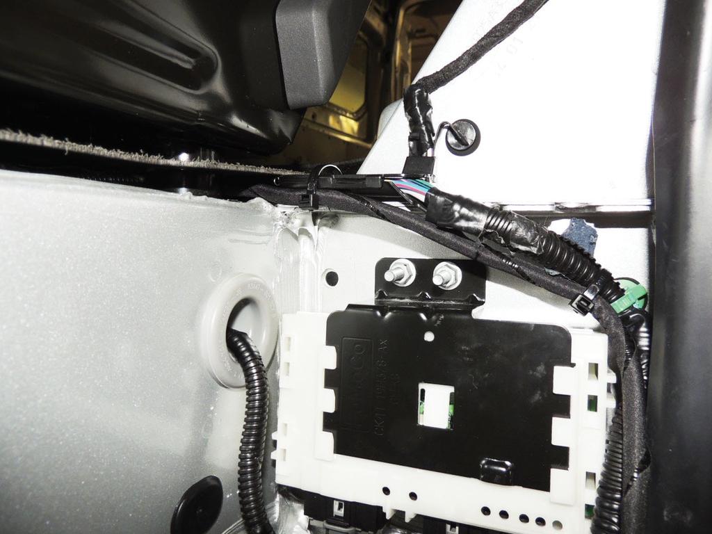 PAGE 18 OF 19 3. Install tie-straps (component F) to the TRM harness, one on the outboard side near the door weatherstrip and the other near the rear of the driver's seat pedestal mount.