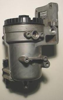 Unplug, disconnect, unbolt, and remove the factory lift pump from the fuel filter housing.
