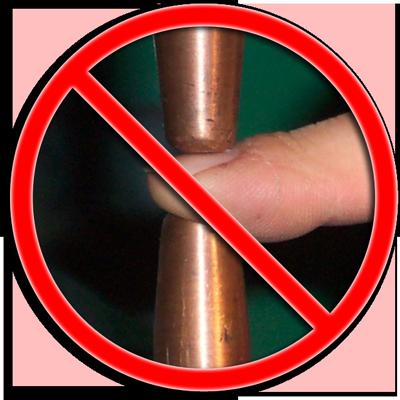 prevent pinching injuries on a spot welder.