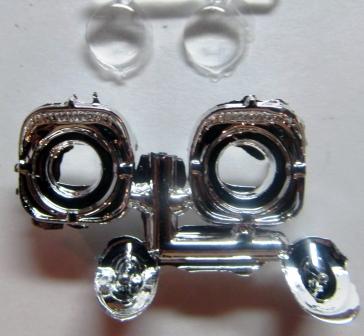 Use Elmer s Glue for the headlights and glue them into the housings.
