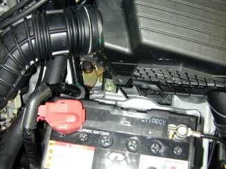 2. Removal of stock system a. Loosen the clamp around the throttle body.