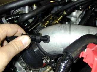 Insert the end of the intake pipe into the coupler on the throttle body.