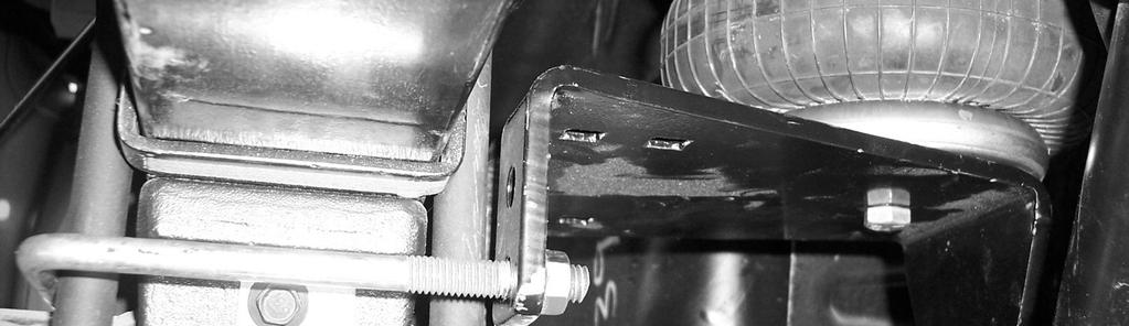 Insert axle bracket between air spring and axle The short bracket is used on driver s side and the long