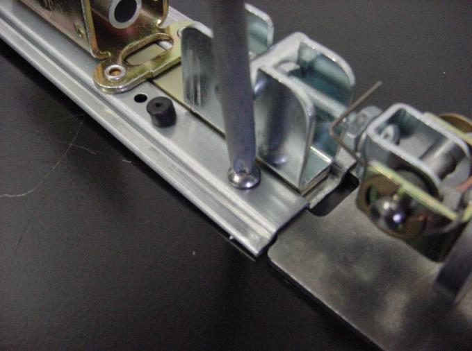 (MAKE SURE TORSION SPRING IS ORIENTED ON TOP AS SHOWN) NEXT INSERT AND SECURE THE