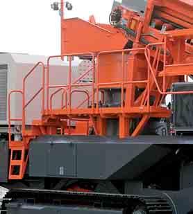 Feed conveyor is hydraulically raised from transport to working position.