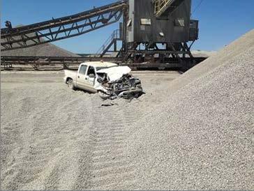 A dozer operator ran over a parked pickup truck.