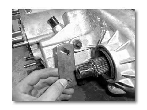 (b) Remove front yoke nut with 1-1/8" socket using an impact wrench. (Fig.