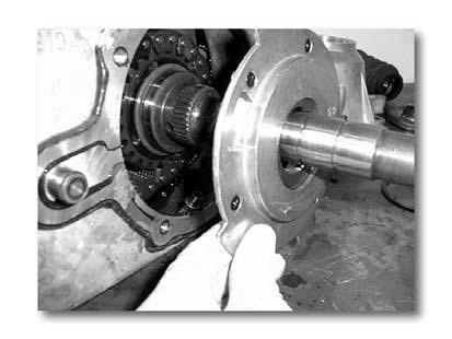 11) Front Drive Chain & Shaft Removal (14) Front output shaft removal: (a) Pull the front output shaft out of the front bearing. (Fig.