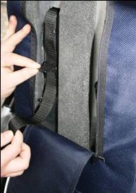 The shoulder straps are passed through the appropriate reinforced position in the backrest.