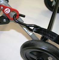 Now that the front of the buggy has been secured, carefully move the buggy backwards to take up the slack in the front restraints, and re-apply the brakes.
