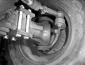 operating hours. - Release the rear axle from load before lubricating the rear axle pivot bolts.