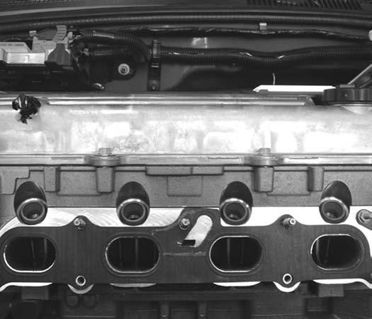 GM SPORT COMPACT Performance Build Book 33 Fig. 29 37. Place the intake manifold in position and install the intercooler port caps (part number 15544596) and clamps (part number 11516226). (Fig.