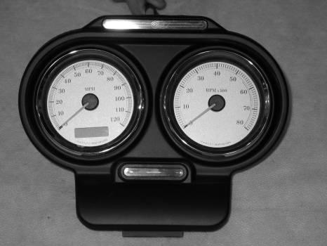 Unplug the gauges, switches and indicator lights so the bezel can be completely removed.