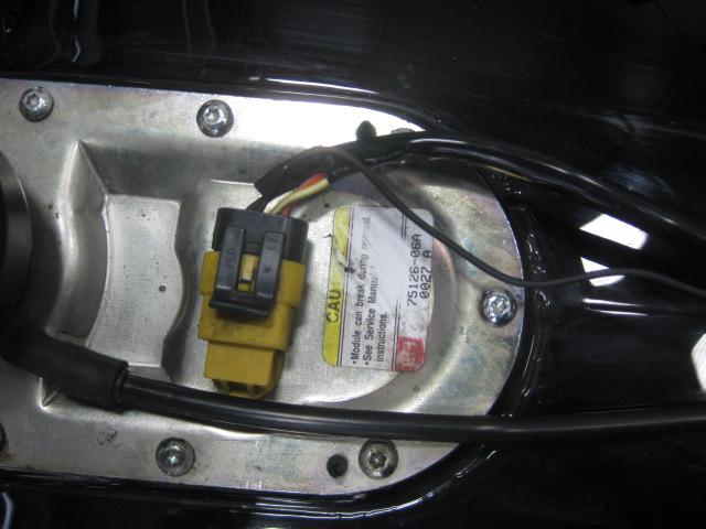 The other end of the long ground wire should be routed under the tank and connect as close to the fuel pump connector as possible.