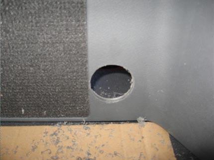 Remove mounting plate, place a 4 ¼ hole saw over the middle of the floor marks (A), and