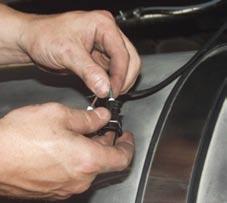 Cut off excess from small feeder tube fuel line and attach to fuel pump. Secure with clamp.