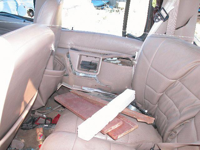The 19-year-old female rear seat right occupant was seated on the leather covered bench seat with folding back. The seat back was slightly reclined by design.