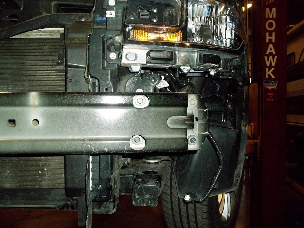 the existing hole in the subframe, bolt the two together on each side using the two supplied ½" x 1¼" bolts, ½" lock washers and ½" nuts (Fig.