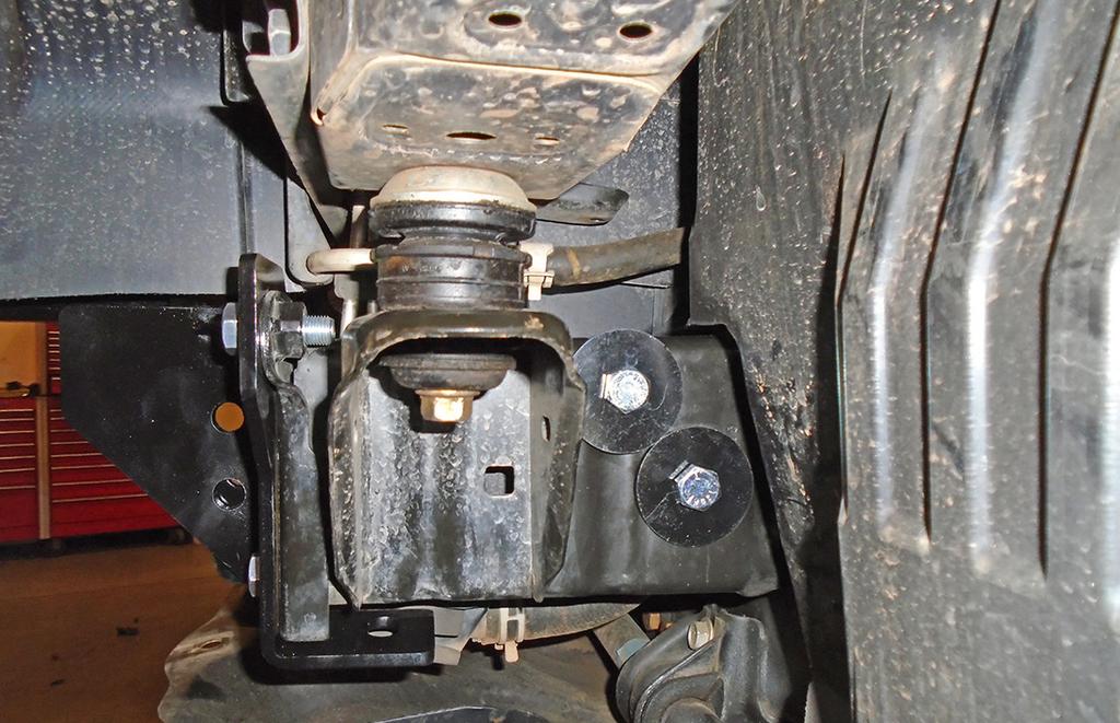 Align the holes of the rear support brace with the main receiver brace and then bolt them together using the two supplied ½" x 1¼" bolt and lock washer and